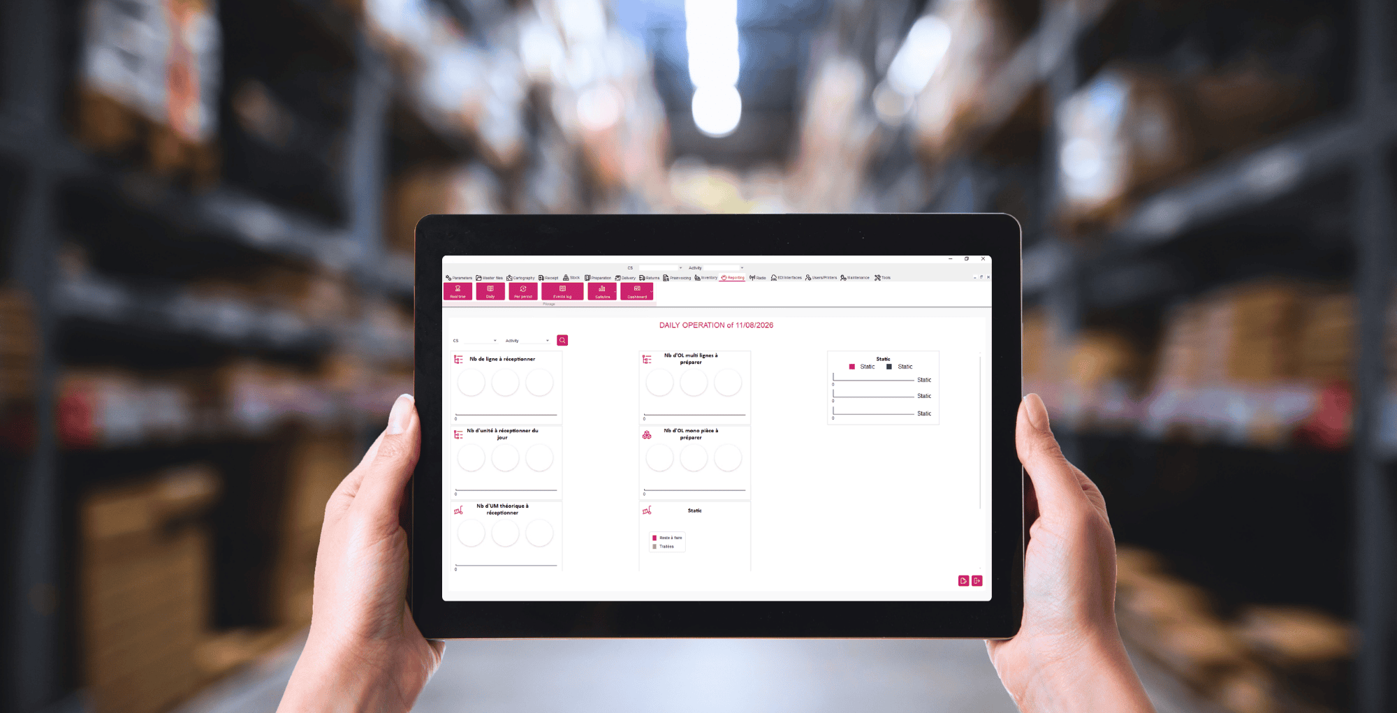 A logistics operator holding a tablet in a warehouse, displaying the ACSEP IzyOne WMS screen